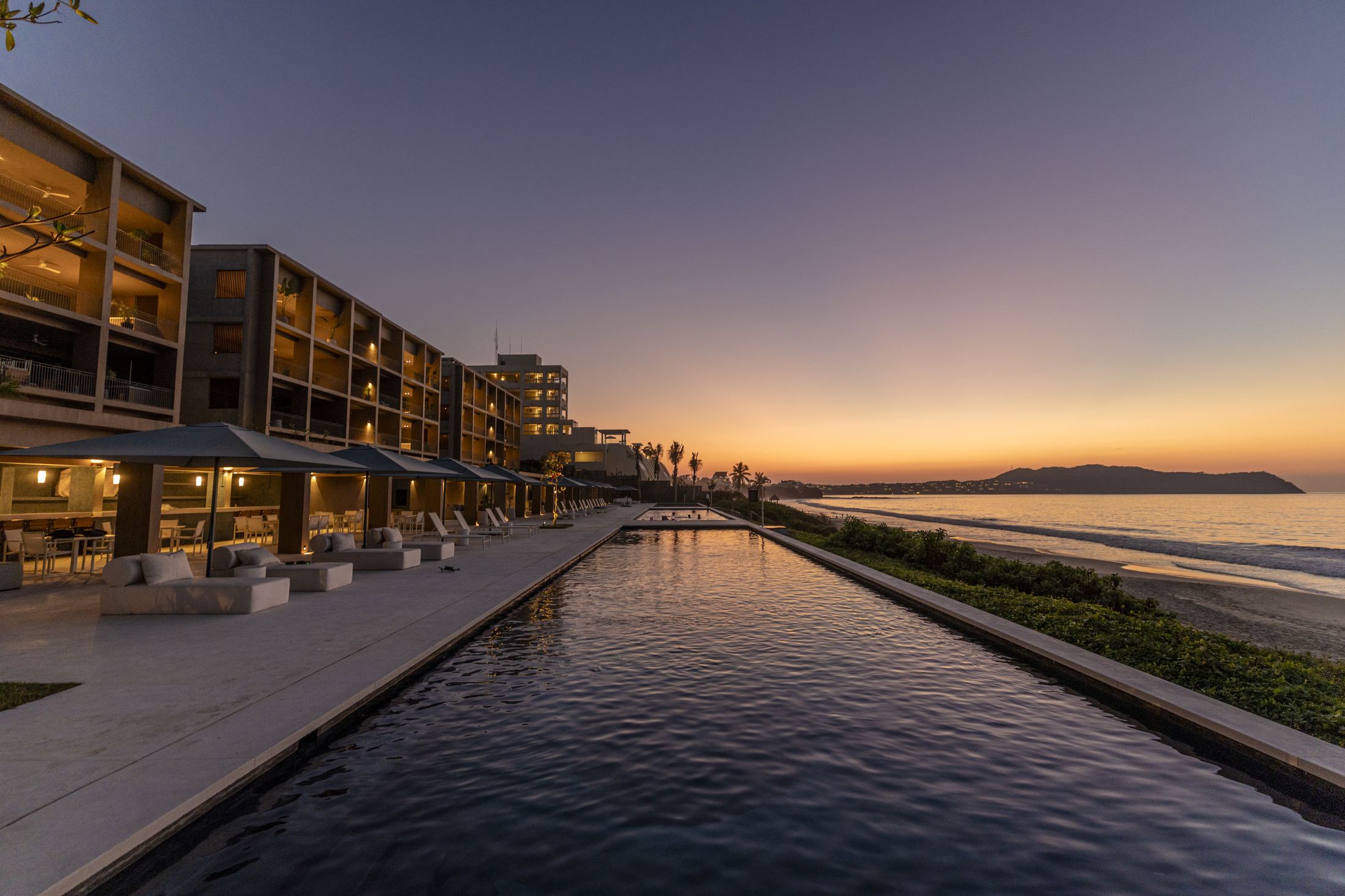 UAVI beachfront residences at sunset on Litibú Bay